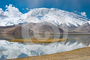 Mustagh Ata Mountain at Karakul Lake in Pamir Mountains, Akto County, Kizilsu Kirghiz Autonomous Prefecture, Xinjiang, China.