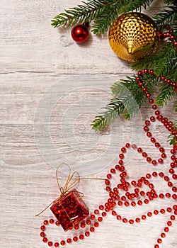 Xmas banner with christmas decorations: balls, beads, gift box and Christmas tree on wooden background. Copyspace. New year top