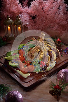 Xmas feast grilled lamb rack wooden plate