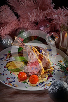 Xmas feast grilled lamb rack wooden plate
