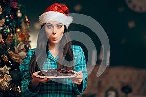 Woman Holding a Tray of Cookies Waiting for Santa Claus