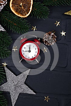 Xmas greeting card. Christmas background with toys and alarm clock. View from above with space for your greetings