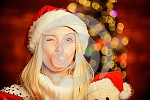 Xmas holiday mood. having fun. celebrate new year at home. last preparation. Christmas time. funny woman red santa hat