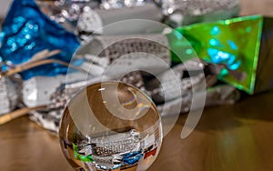 Xmas present wrappings reflected in a crystal ball