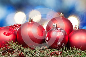 Xmas red balls on blurred blue background