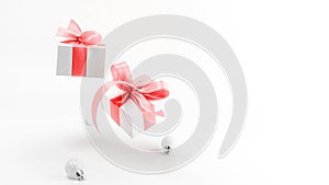 Xmas sale. White gifts with red ribbon and New Year balls in Christmas decoration on white background for greeting card. Xmas