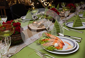 Xmas tree folded napkins on dinner table