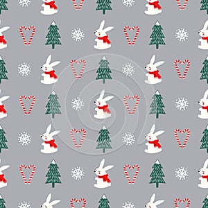 Xmas tree, snowflakes, rabbit, candy canes heart seamless pattern on grey background.