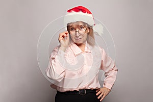 Xmas woman granny in red Santa hat, Christmas portrait