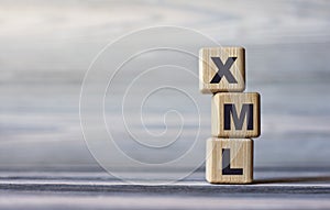 XML - word on wooden cubes against the background of a light board with beautiful divorces