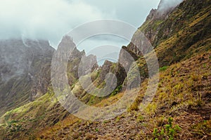 Xo-Xo Valley, Santo Antao Island, Cape Verde Cabo Verde. Rugged mountain peak overgrown with verdant grass and encase by