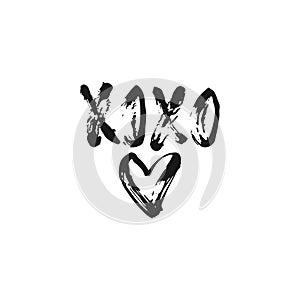 XOXO - hand drawn lettering phrase for Valentines day isolated on the white background. Fun brush ink inscription for