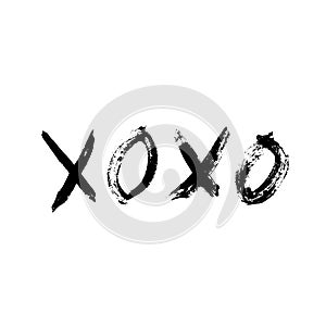 XOXO hand written phrase isolated on white background. Grunge Hugs and kisses sign. Expressive lettering XO. Easy to edit template photo