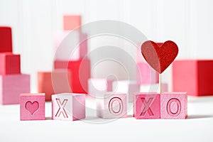 XOXO message with pink and red blocks