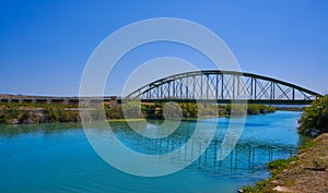 Xuquer Jucar river metal bridge in Fortaleny of Valencia photo