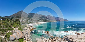 XXL aerial panoramic drone view of Camps Bay, an affluent suburb of Cape Town, South Africa.