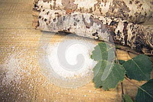 Xylitol - sugar substitute. Birch sugar on wooden background.