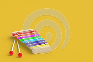 Xylophone isolated on yellow background. Kids toy. Preschool education