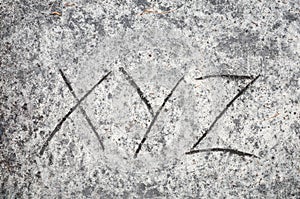 Xyz letters on sand background photo
