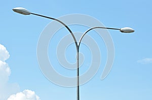 Y shape street lamp pole with blue sky