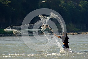 Yaan China-A net fishing man in Qingyi River