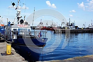 Yach fishing boat moored in port