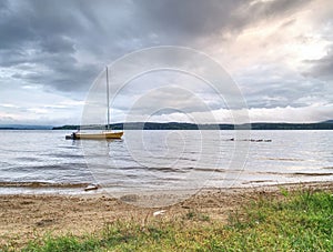 Yacht on an anchor at harbor, boats series