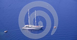 Yacht anchored to shore in Greece, Santorini Island