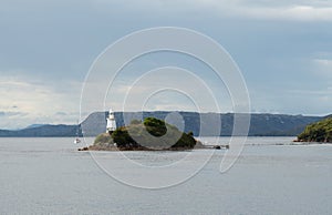 Yacht approaching the lighthouse in Macquarie Harbour