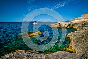 Yacht boat at Sarakiniko Beach in Aegean sea, Milos island , Greece