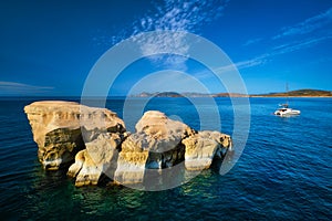 Yacht boat at Sarakiniko Beach in Aegean sea, Milos island , Greece