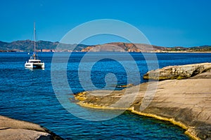 Yacht boat at Sarakiniko Beach in Aegean sea, Milos island , Greece