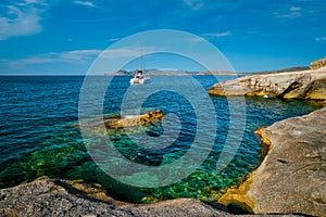 Yacht boat at Sarakiniko Beach in Aegean sea, Milos island , Greece