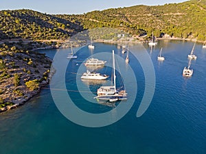 Yacht in a calm bay from above