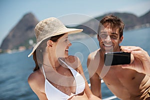 Yacht, couple and selfie at sea for luxury vacation, summer travel and outdoor adventure together. Relax, happy man and