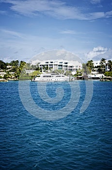 Yacht in front of houses