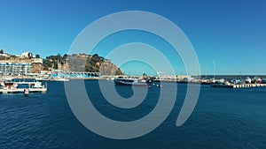 Yacht harbor with luxury motorboats. Sea Lagoon with blue water at sunny day