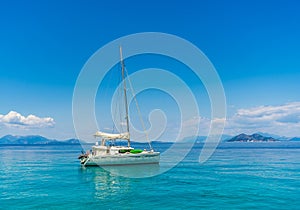 Yacht in Ionion sea with amazing background- beautiful clouds and blue sky