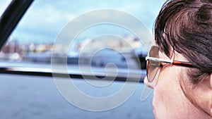 Yacht Journey: Close-up of a Woman Exploring Docked Ships