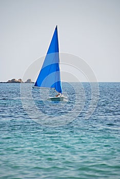 Yacht in light blue aegean sea