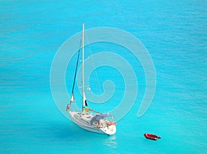 Yacht in light blue ionian sea