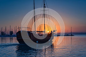 Yacht marina on Balaton lake at sunset, scenic view of the boats, sun, sky and water, outdoor travel background, Siofok, Hungary