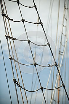 Yacht mast against blue summer sky. Yachting