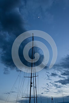 Yacht mast with evening sky and moon - Image