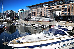 Yacht and modern district on street Stranden, Aker Brygge in Osl