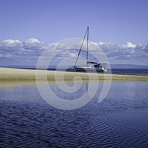 Yacht Moored off a Beach in Australia