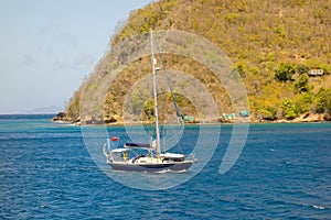 A yacht motoring into admiralty bay, bequia