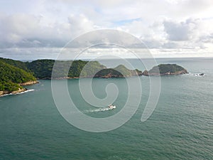 Yacht near Roqueta Island captured by Acapulco drone amidst cloudy skies photo