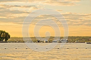 Yacht at the pier at sunset on summer