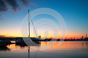 Yacht port and beautiful sunset over Varna, Bulgaria. Sailboat harbor, many beautiful moored sail yachts in the sea